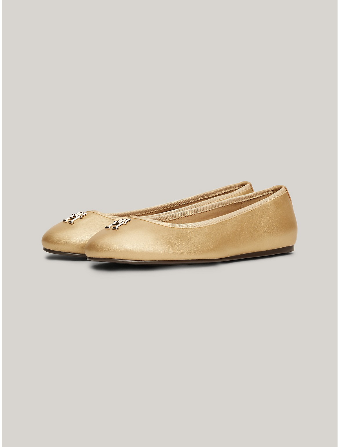 Shop Tommy Hilfiger Th Logo Luxe Leather Ballerina Flat In Gold