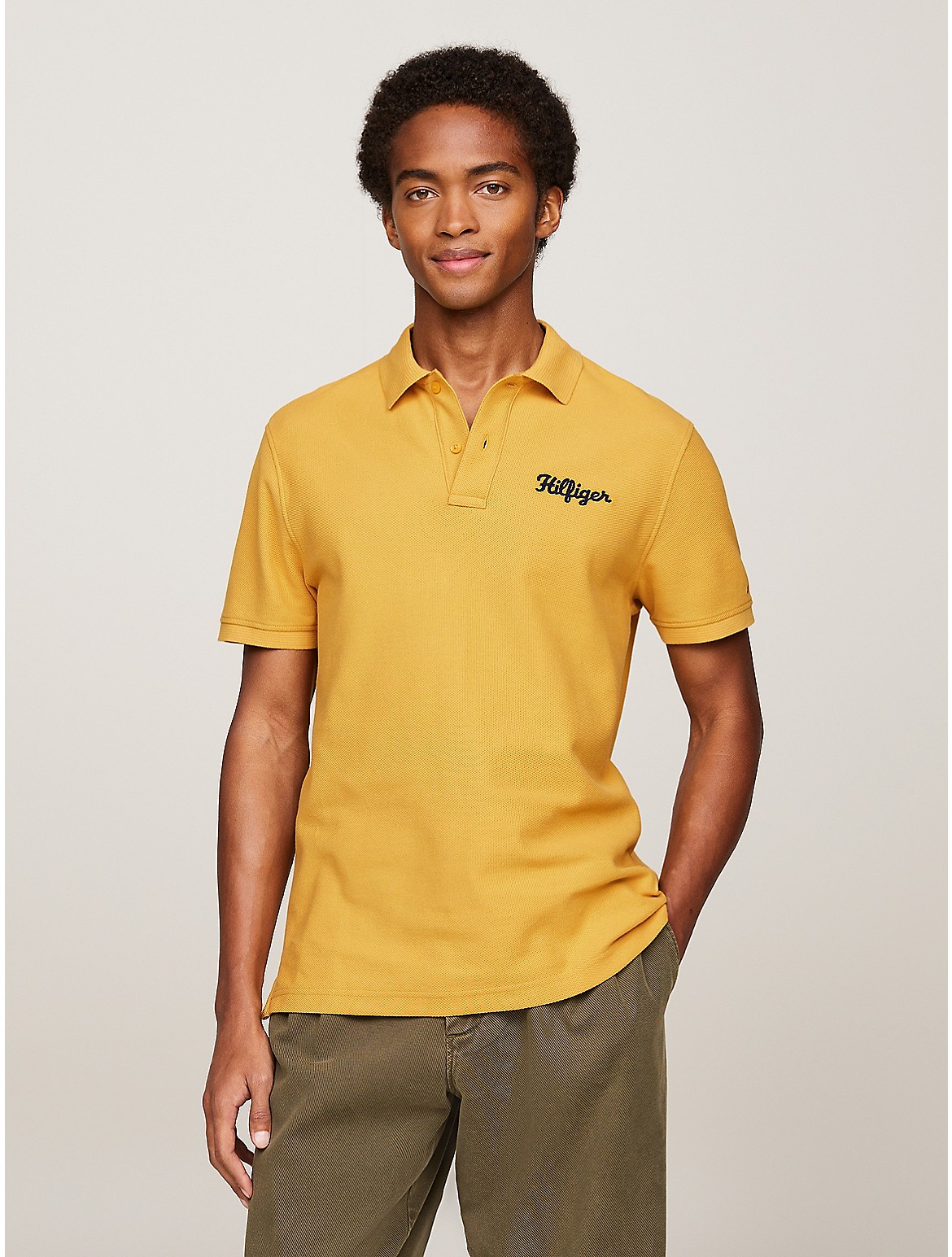 Shop Tommy Hilfiger Regular Fit Hilfiger Stitch Logo Polo In City Yellow
