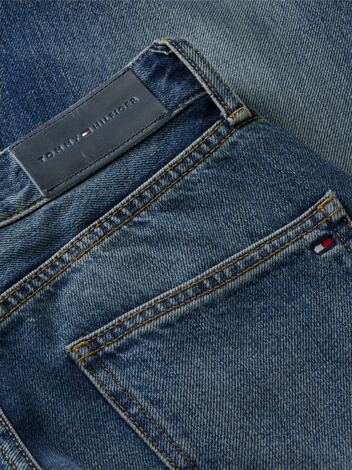 High-Rise Logo Hardware Tapered Jean — Elan
