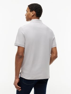 Мужские топы Tommy Hilfiger Regular Fit Quarter-Zip Wicking Polo — фото 4